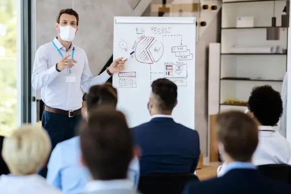 businessman-wearing-face-mask-while-giving-presentation-board-room_637285-9167 (1)